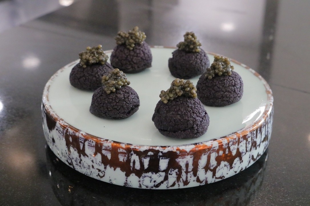 Dark choux with caviar